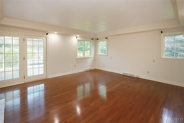 unfurnished room featuring dark hardwood / wood-style floors and crown molding