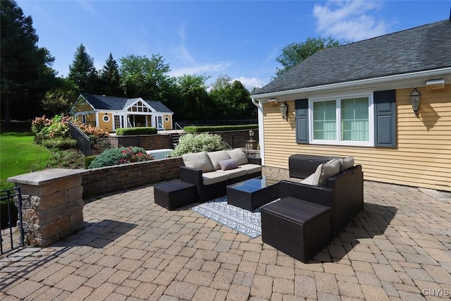 view of patio / terrace featuring an outdoor living space and an outdoor structure