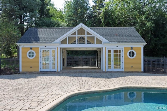 view of pool featuring a patio and an outdoor structure