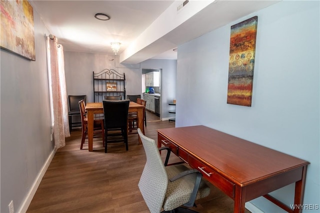 dining room with hardwood / wood-style flooring