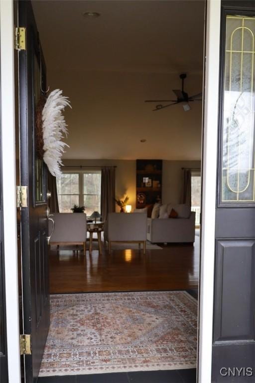 entrance foyer featuring wood-type flooring and ceiling fan