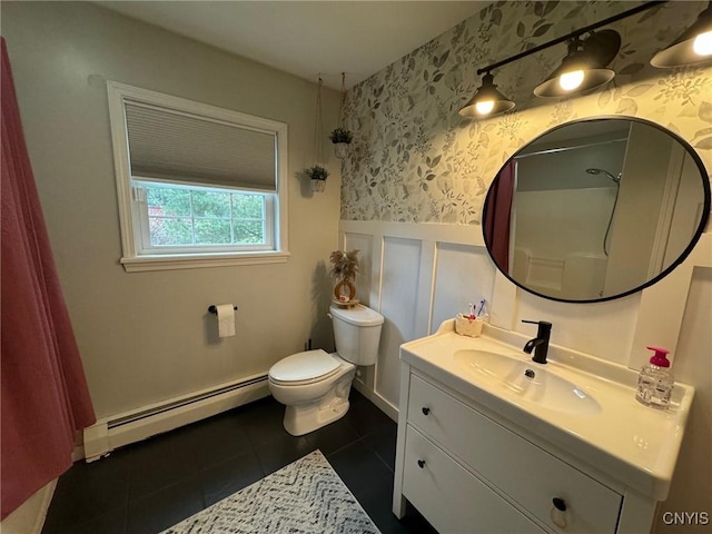 bathroom featuring tile patterned flooring, vanity, a baseboard radiator, and toilet