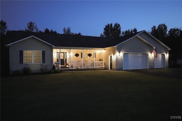 ranch-style house with covered porch and a garage