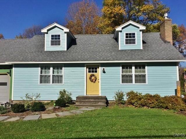 new england style home with a front yard