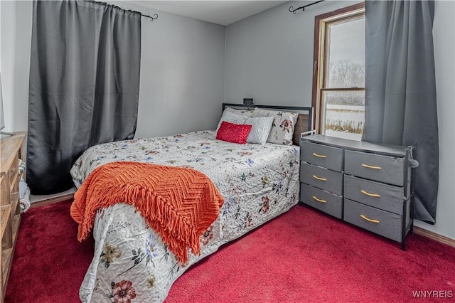 bedroom featuring dark colored carpet