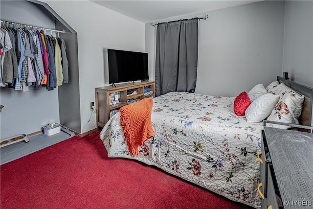 carpeted bedroom featuring a closet