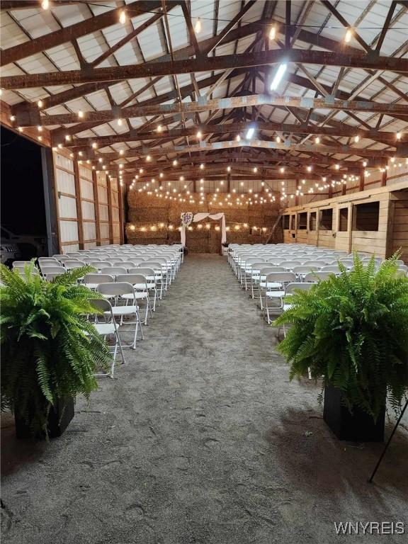 exterior space featuring beam ceiling and high vaulted ceiling