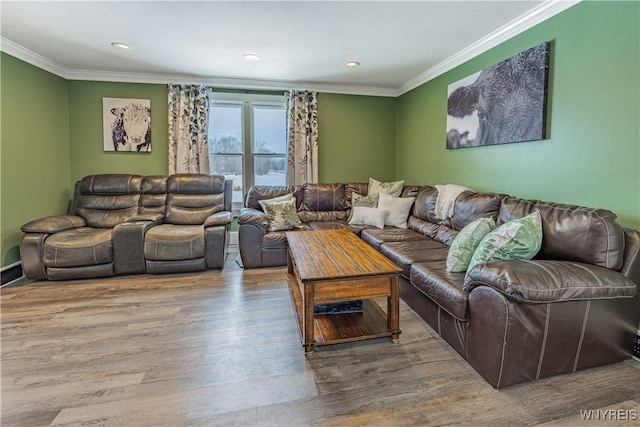 living room with crown molding and hardwood / wood-style flooring