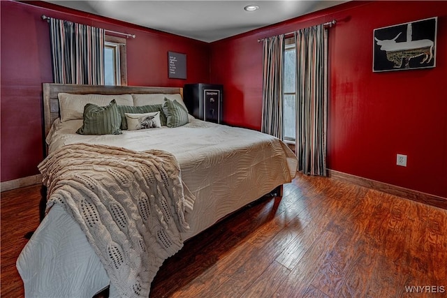 bedroom with hardwood / wood-style floors