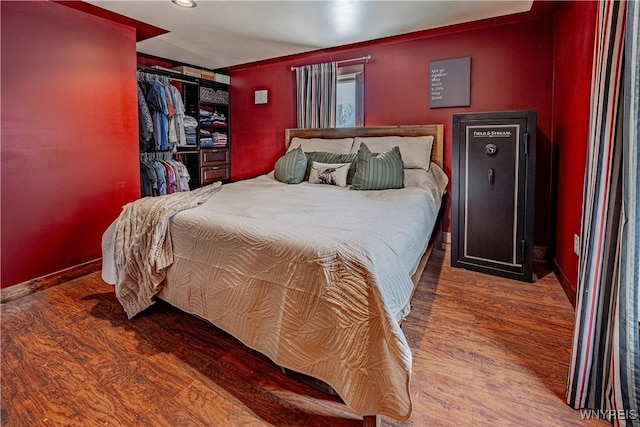 bedroom with wood-type flooring