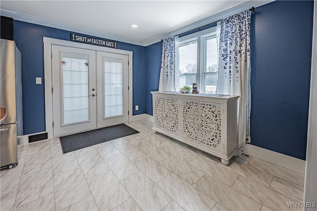 entrance foyer with french doors and ornamental molding