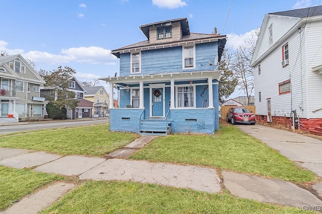 view of front property featuring a porch and a front lawn