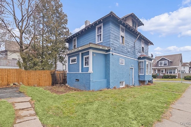 view of home's exterior featuring a lawn