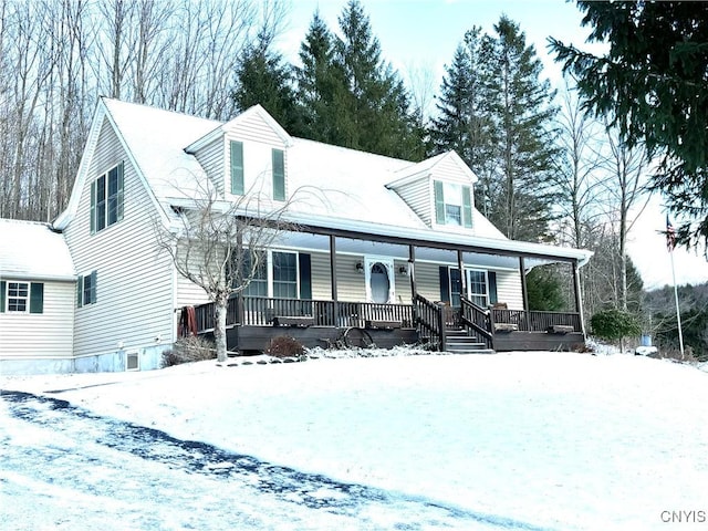 new england style home featuring a porch