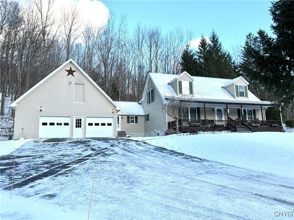 view of front of property featuring a garage and covered porch