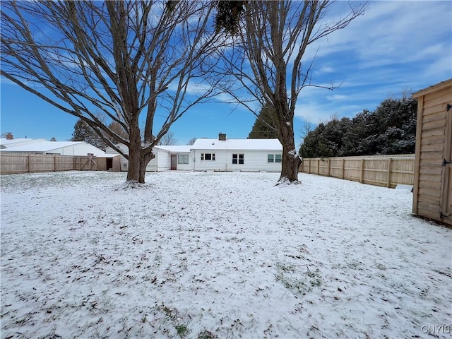 view of yard covered in snow