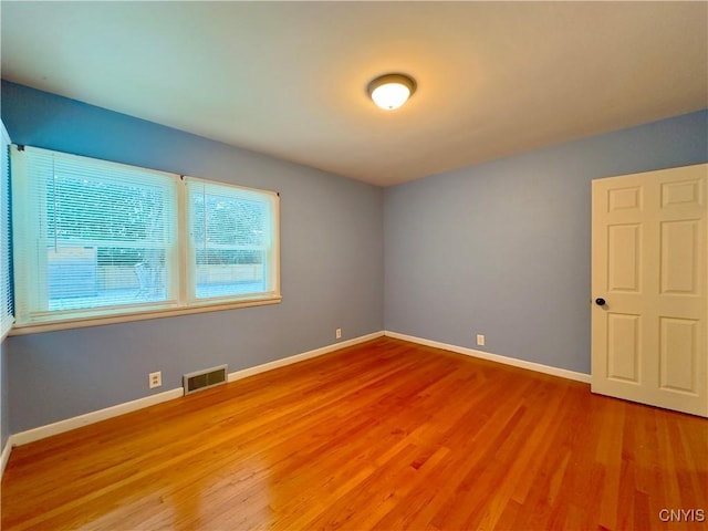 empty room featuring hardwood / wood-style flooring