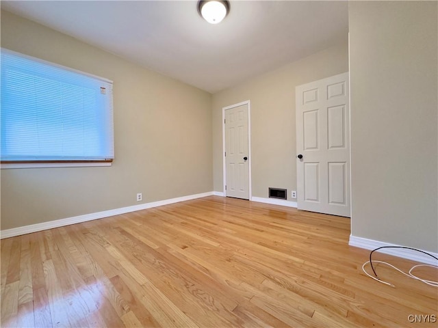 empty room with light wood-type flooring