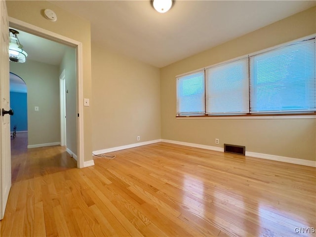 unfurnished room featuring light wood-type flooring