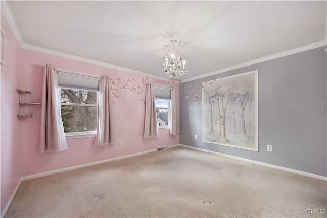 carpeted empty room featuring crown molding and a chandelier