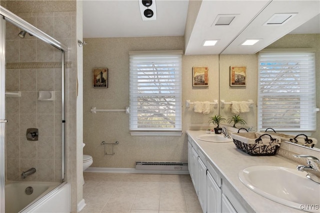 full bathroom with baseboard heating, tile patterned flooring, enclosed tub / shower combo, toilet, and vanity