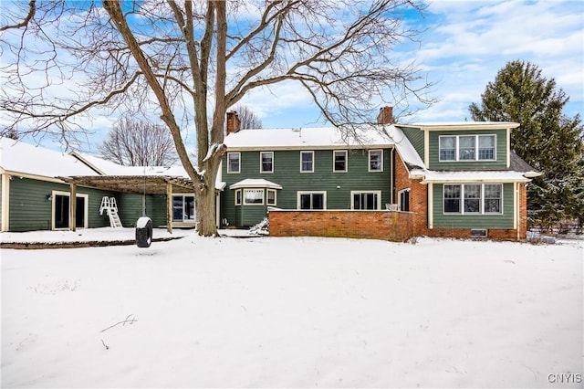 view of snow covered property