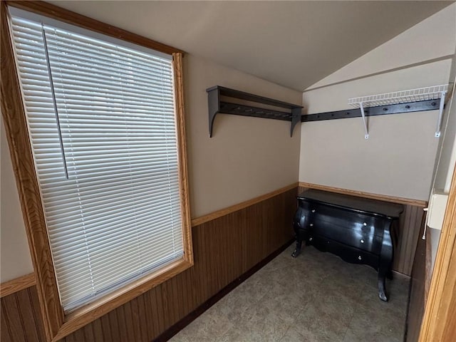 walk in closet with lofted ceiling