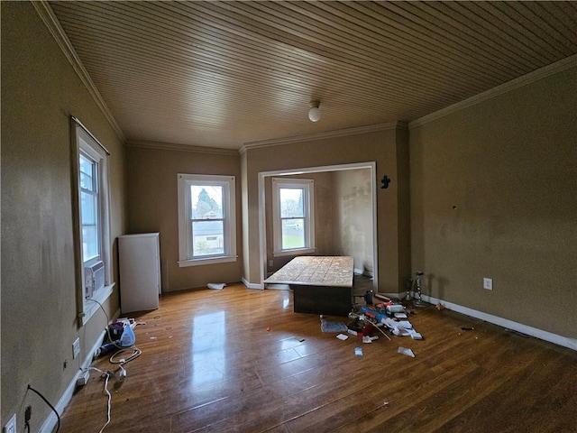 interior space with hardwood / wood-style floors, plenty of natural light, and crown molding