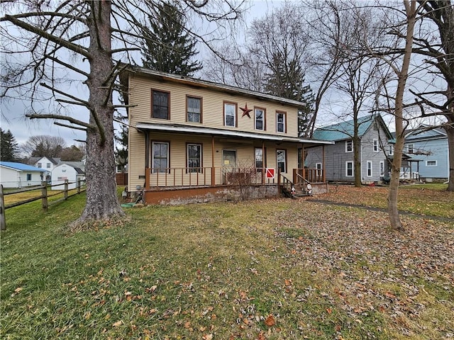 view of front of home featuring a porch and a front lawn