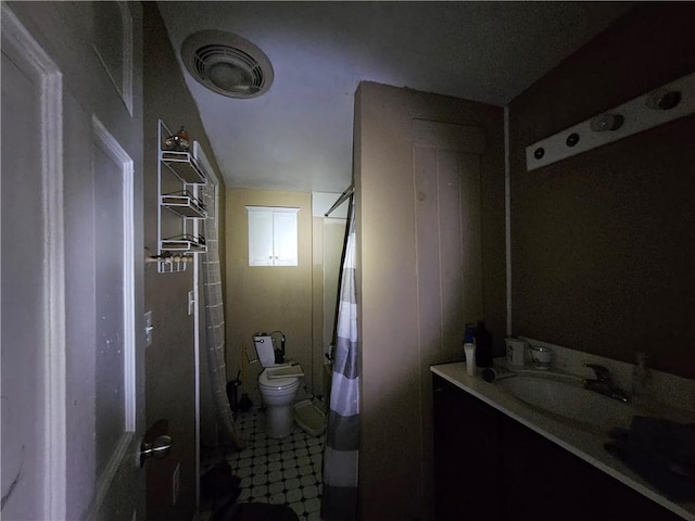 bathroom with vanity and toilet