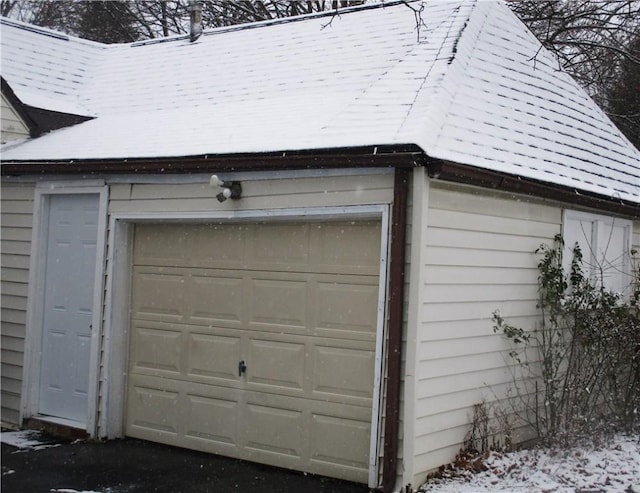 view of snow covered garage