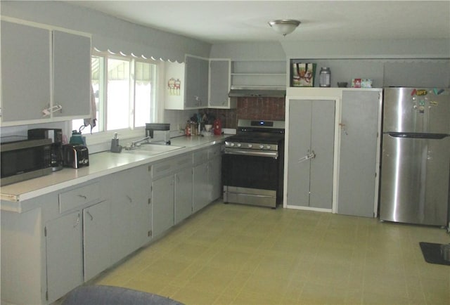 kitchen with gray cabinets, sink, and stainless steel appliances