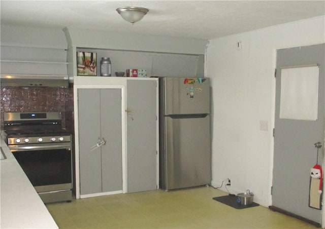 kitchen featuring range hood and appliances with stainless steel finishes