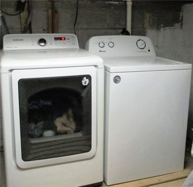 laundry area with separate washer and dryer