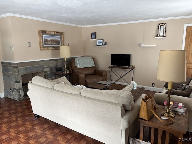 living room featuring dark parquet flooring, a stone fireplace, and crown molding