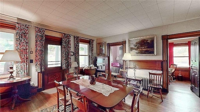 dining space featuring wood-type flooring