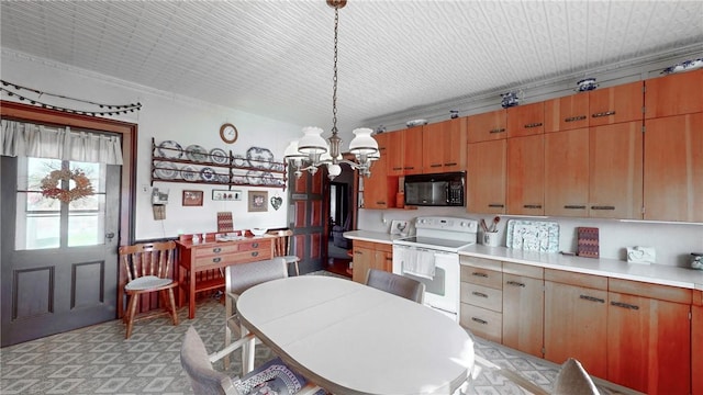 kitchen with a chandelier, pendant lighting, and white electric range