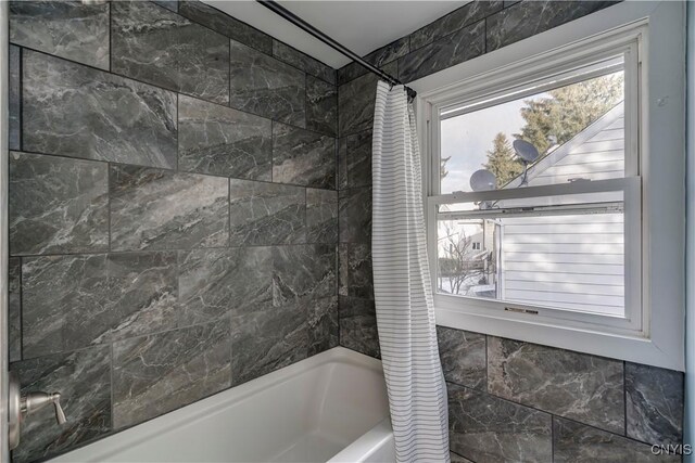 bathroom with shower / tub combo