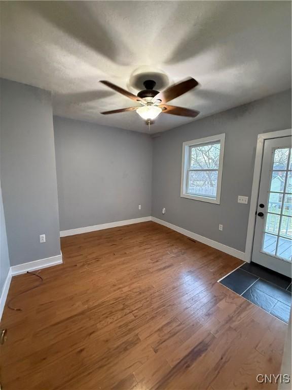 interior space with ceiling fan and hardwood / wood-style floors