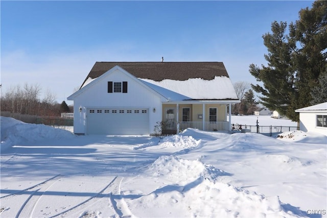 view of front of home with a garage and covered porch