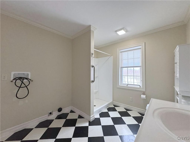 bathroom with a shower, vanity, and ornamental molding