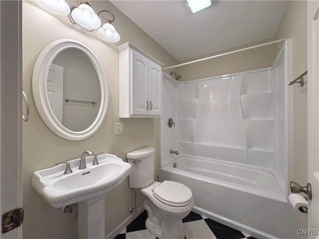 bathroom with bathtub / shower combination and toilet