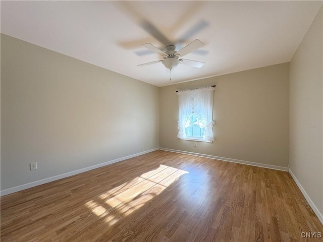 spare room with ceiling fan and light hardwood / wood-style floors