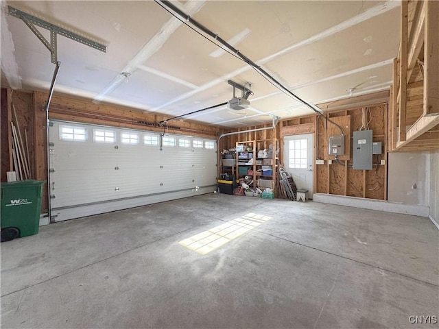 garage with electric panel and a garage door opener