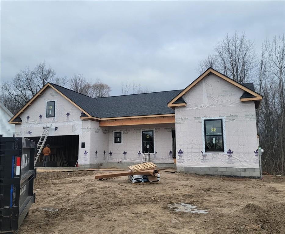 unfinished property featuring a garage