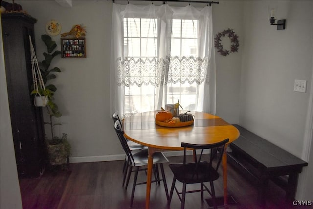 dining area with dark wood-type flooring