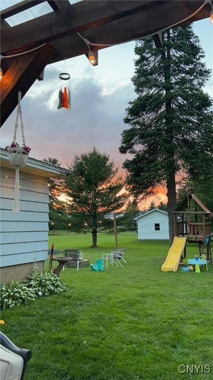 yard at dusk with a playground