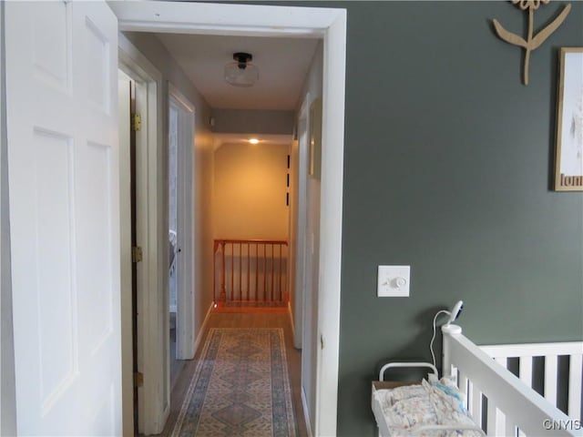 hallway with dark hardwood / wood-style floors