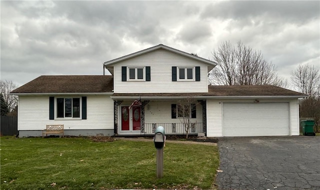 view of front facade featuring covered porch, a garage, and a front lawn