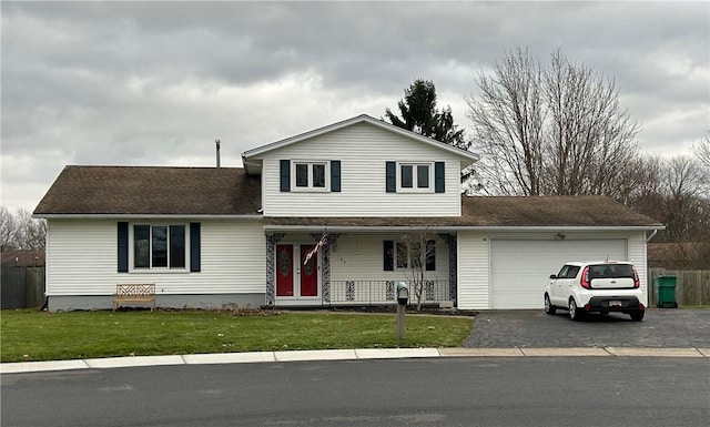 view of front property with a porch, a garage, and a front lawn